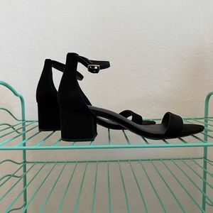 black open toed heeled shoe.